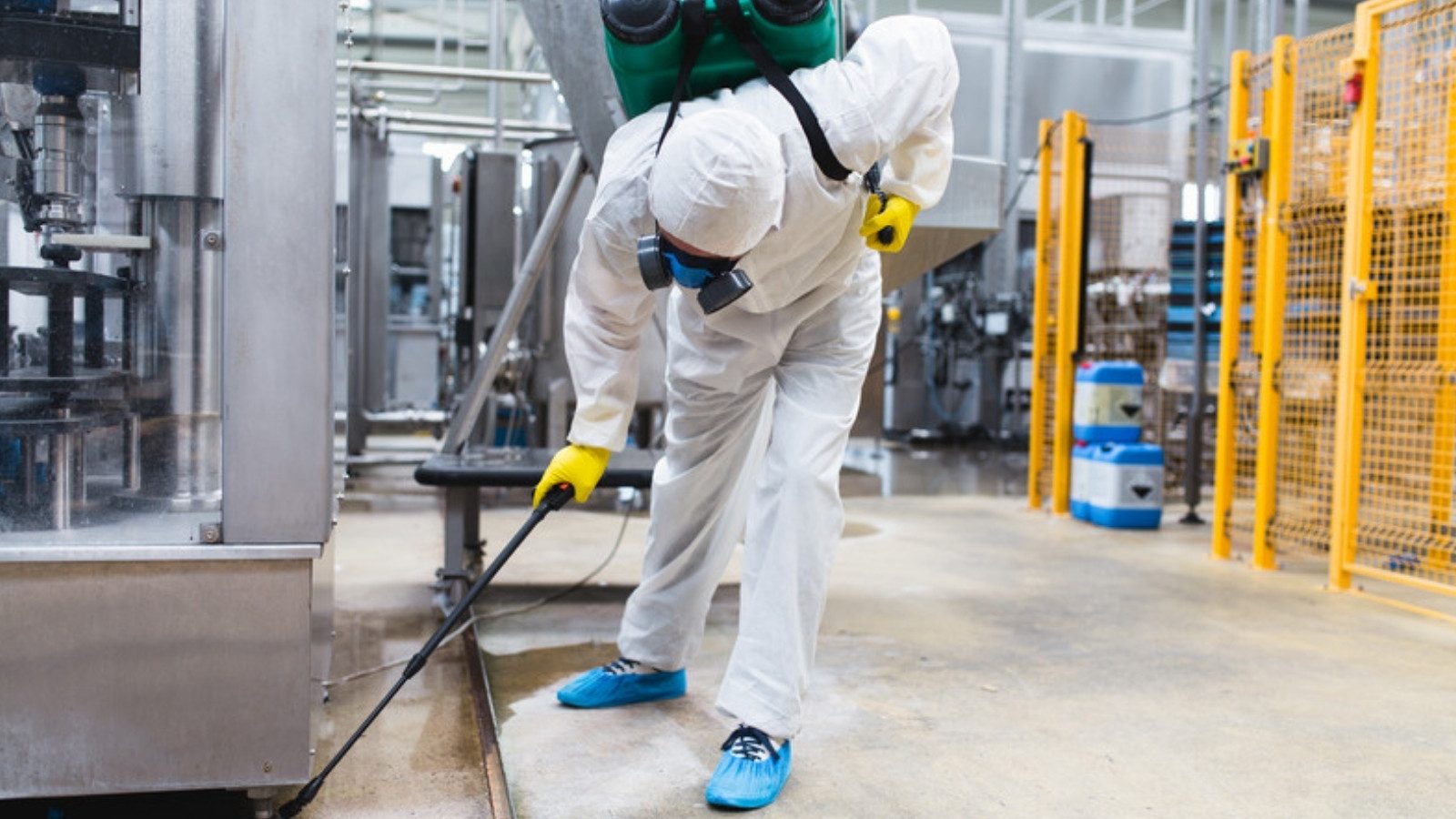 A pest control technician treating a commercial facility