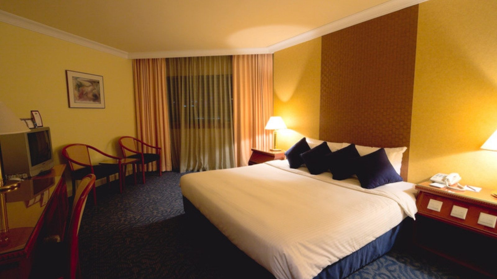 A made bed in a hotel room